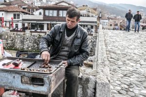 kosovo balkans stefano majno prizren man selling  vendor.jpg